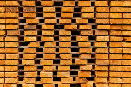 Wooden boards stacked in a sawmill. Wooden boards prepared for productionの写真素材