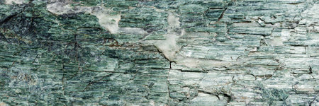 Natural green granite stone as background. panorama