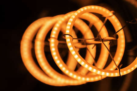 Closeup of a spiral LED bulb lightの写真素材