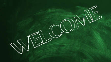 Welcome written on green chalkboard in the schoolの写真素材