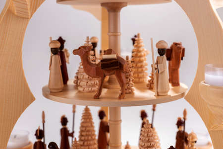 Detail of typical wooden Christmas pyramid with wooden treesの写真素材