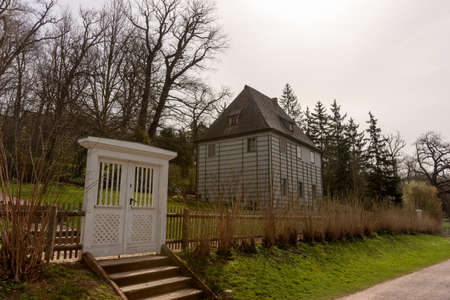 Large white wooden gate leading into the gardenの写真素材