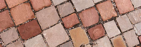Panoramic red stone background. Red paving stones on a sidewalkの写真素材