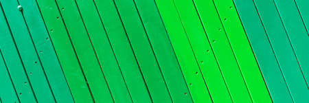 Wooden panoramic green background. Wooden slats in different shades of greenの写真素材