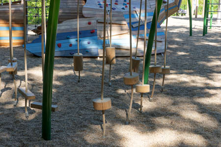 Playground for children in the shade of the treesの写真素材