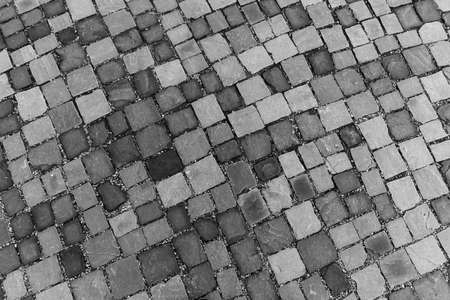 Gray paving stones on a sidewalk. Stone backgroundの写真素材