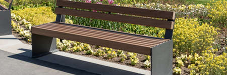Modern garden bench in the park. Panoramic imageの写真素材