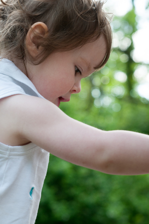 Young girl having fun outdoors in the back yardの写真素材