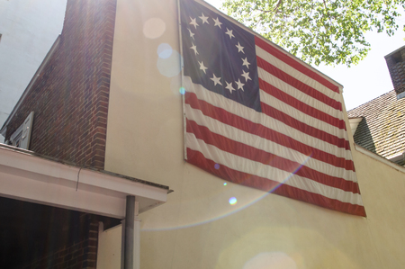 PHILADELPHIA, PA - MAY 14: American thirteen point historic flag often named the Betsy Ross flag, in front of the Betsy Ross House at 239 Arch Street on May 14, 2015のeditorial素材