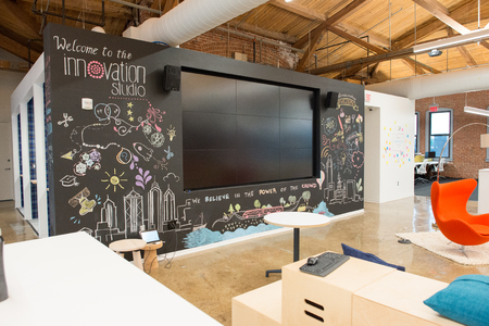 Trendy modern open concept loft office space with big windows, natural light and a layout to encourage collaboration, creativity and innovationの写真素材