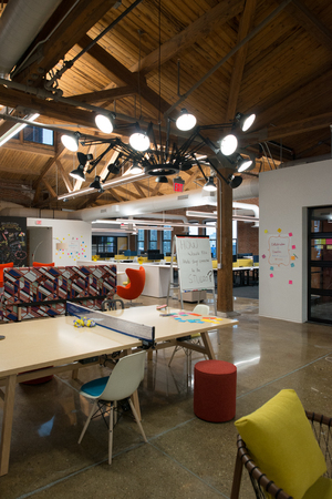 Trendy modern open concept loft office space with big windows, natural light and a layout to...