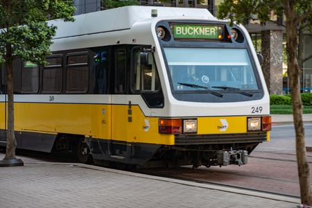 Dallas, Texas - May 7, 2018: The Dallas DART light rail train drives through Dallas, Texasのeditorial素材