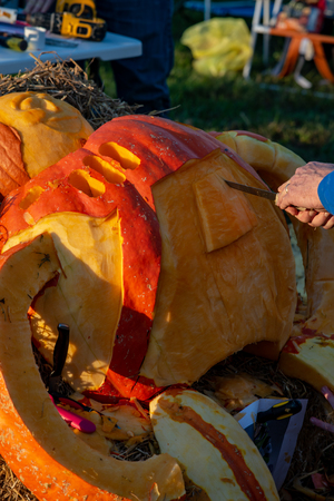 CHADDS FORD, PA - OCTOBER 18: Person carving pumpkin at The Great Pumpkin Carve carving contest on October 18, 2018のeditorial素材