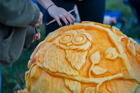 CHADDS FORD, PA - OCTOBER 18: Person carving pumpkin at The Great Pumpkin Carve carving contest on October 18, 2018のeditorial素材