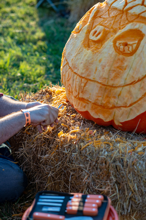 CHADDS FORD, PA - OCTOBER 18: Person carving pumpkin at The Great Pumpkin Carve carving contest on October 18, 2018のeditorial素材