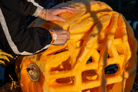 CHADDS FORD, PA - OCTOBER 18: Person carving pumpkin at The Great Pumpkin Carve carving contest on October 18, 2018のeditorial素材