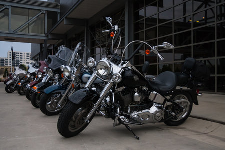 Milwaukee, WI, USA May 28 2011: Shiny motorcycles parked outside of the Harley-Davidson Museum building entrance in Milwaukee, Wisconsin. This is a top tourist destination.のeditorial素材
