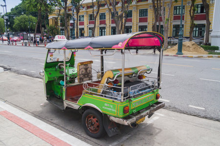 Bangkok, Thailand June 24 2017: a tuk-tuk parked on the street in Bangkok. This is a popular means...