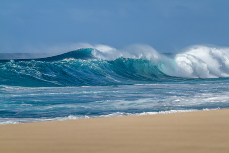 Breaking Ocean wave on the beach in Hawaiiの写真素材
