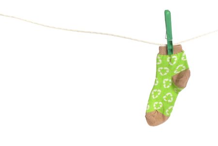 childs recycling symbol socks on laundry line. Energy conservation themeの写真素材