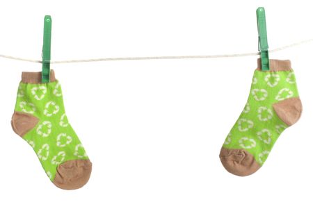 childs recycling symbol socks on laundry line. Energy conservation themeの写真素材