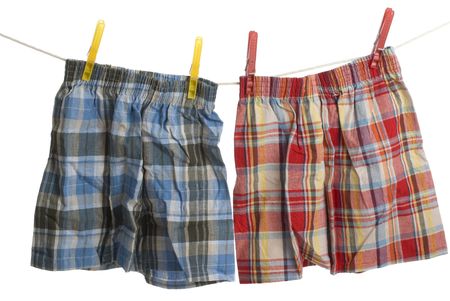 two pairs of Boxer shorts hang on laundry lineの写真素材