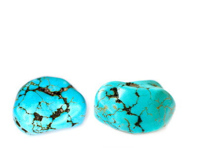Two stones of turquoise on white backgroundの写真素材