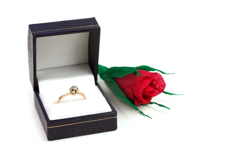 Diamond ring in case and paper red roseの写真素材