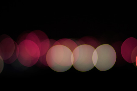 Defocused bokeh effect purple, violet lightsの写真素材