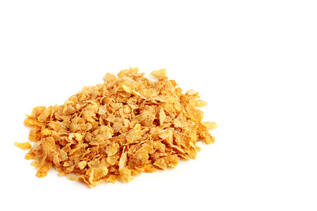 Heap of corn flakes on white background