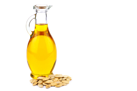 Pumpkin seed oil in bottle on white backgroundの写真素材
