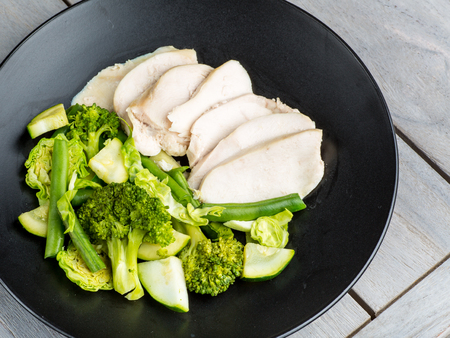 Clean chicken and green vegetablesの写真素材