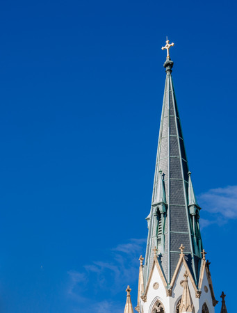 A church spire against an almost perfectly blue sky の写真素材