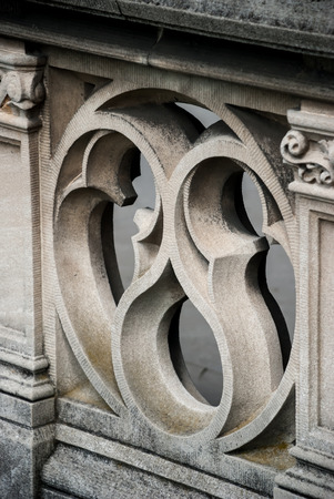 A sculpted railing provides detail on the balcony of an historic buildingの写真素材