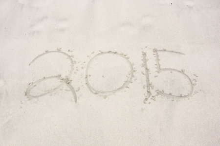 The year 2015 is written in the sand on a beach in the Caribbeanの写真素材