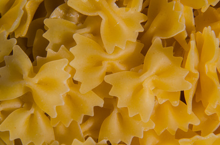 A background of raw bowtie pasta
