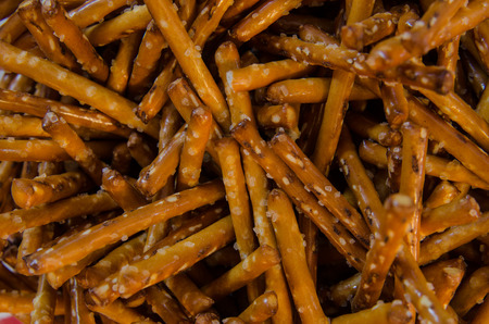 A background image of pretzel sticks in a jarの写真素材