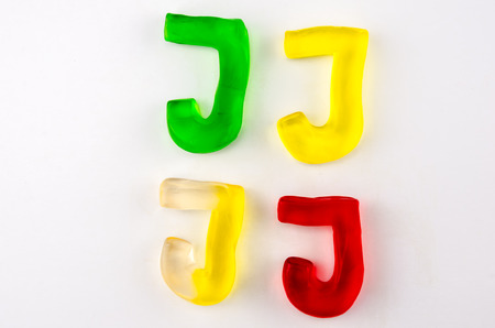 A set of four gummy letters in the shape of J isolated on whiteの写真素材