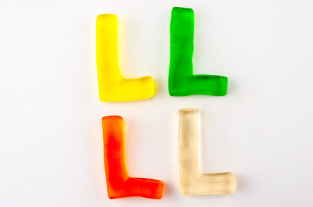 A set of four gummy letters in the shape of L isolated on whiteの写真素材