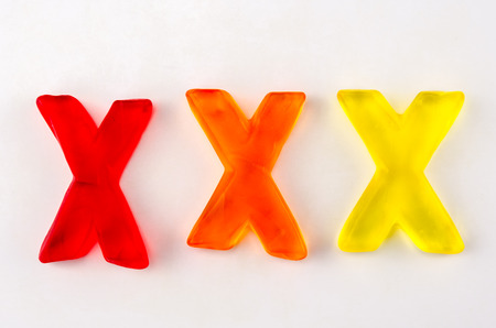 A set of three gummy letters in the shape of X isolated on whiteの写真素材