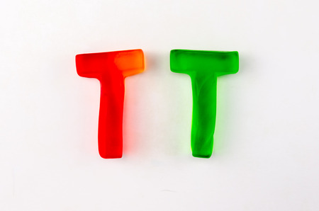A set of two gummy letters in the shape of T isolated on whiteの写真素材