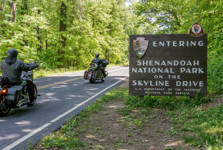Motorcyclists enter the Shenandoah National Park to coast along Skyline Driveのeditorial素材