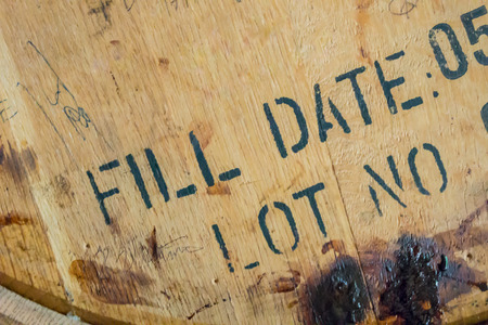 Top of a bourbon barrel aging in a distillery