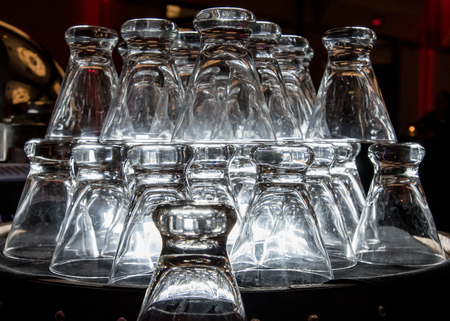 Clear Glasses Stacked in a buffet lineの写真素材