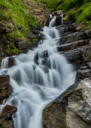 Alder Creek Falls tumbles over layered rocksの写真素材