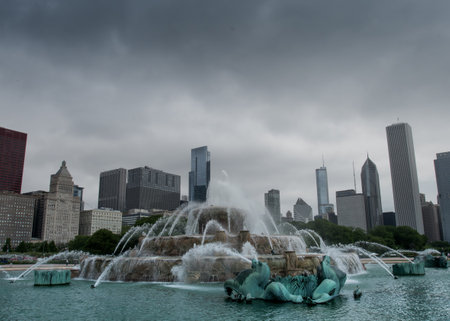 Chicago, United States: May 27, 2016: Buckingham fountain with skyline on cloudy day. After a long wait for restoration, the fountain is running during daytime hours.のeditorial素材