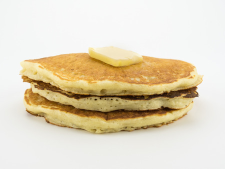 Pancakes in Stack with Pat of Butter on Whiteの写真素材