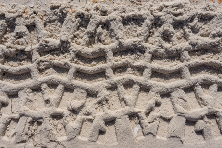 Thick Tire Treads in Sand Background Imageの写真素材