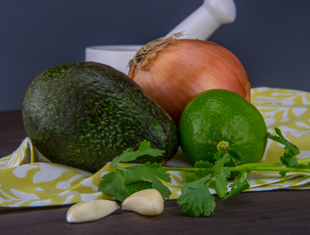 Guacamole Ingredients Together on Green Cloth Napkinの写真素材