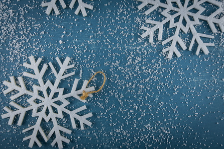 Snowflakes and Snow Scattered on blue backgroundの写真素材